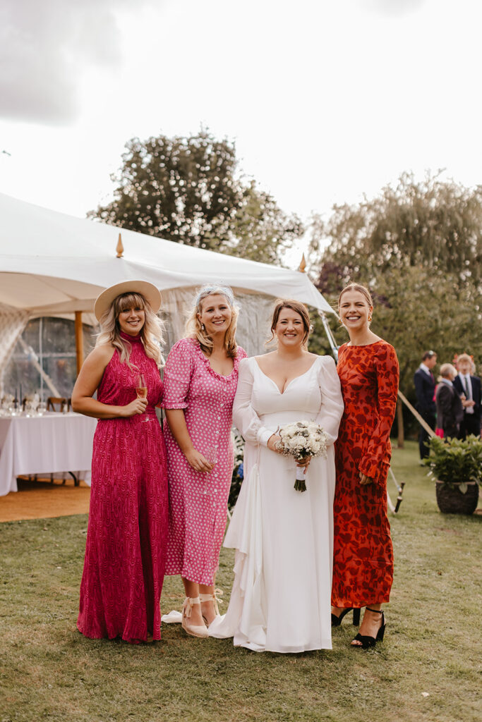 Bride and guests portraits at a private marquee wedding