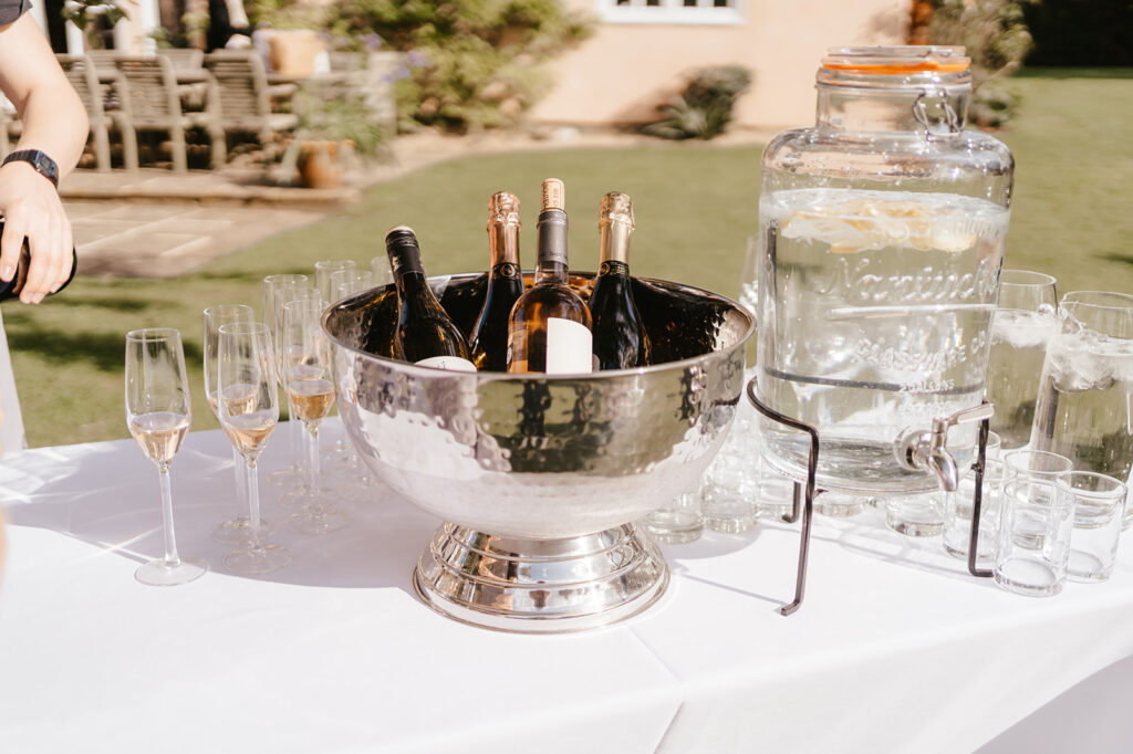 Drinks on the lawn outside at a private marquee wedding