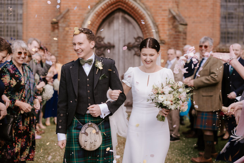 bride groom confetti out of church