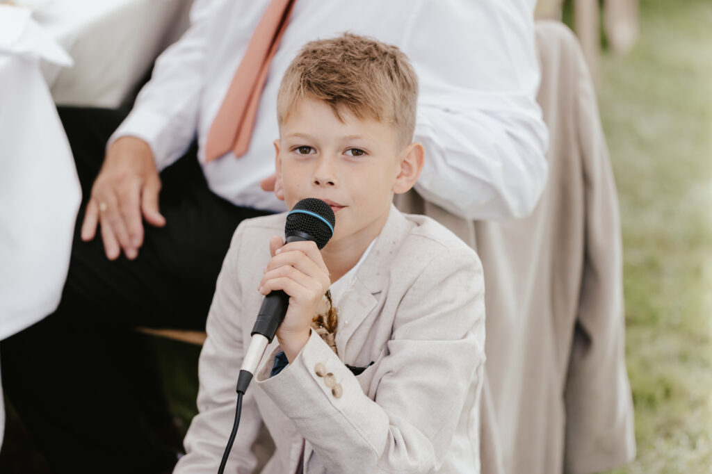 A child making a speech during the wedding speeches at a Suffolk wedding venue 